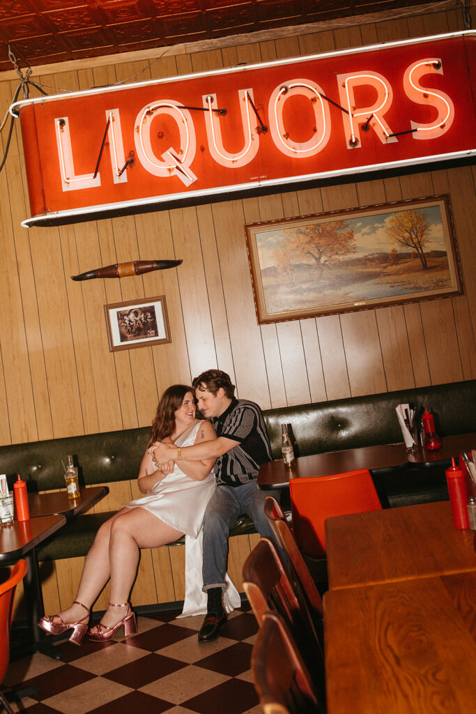 couple at dive bar for their Minneapolis Engagement Photos