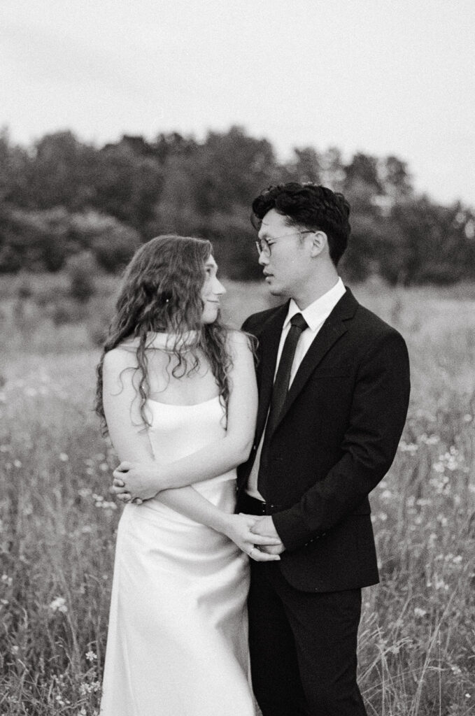 A MN couples photographer captures a b+w image of a couple during an outdoor session 