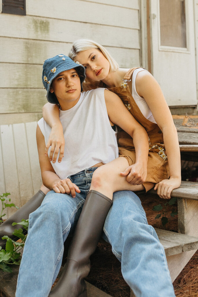 An LGBTQ+ couple is photographed in a rural setting by a Twin Cities couples photographer