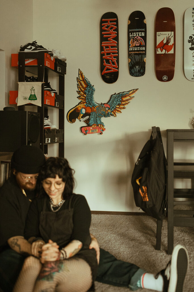 A young couple is photographed in their living room during engagement photos Milwaukee, WI. 