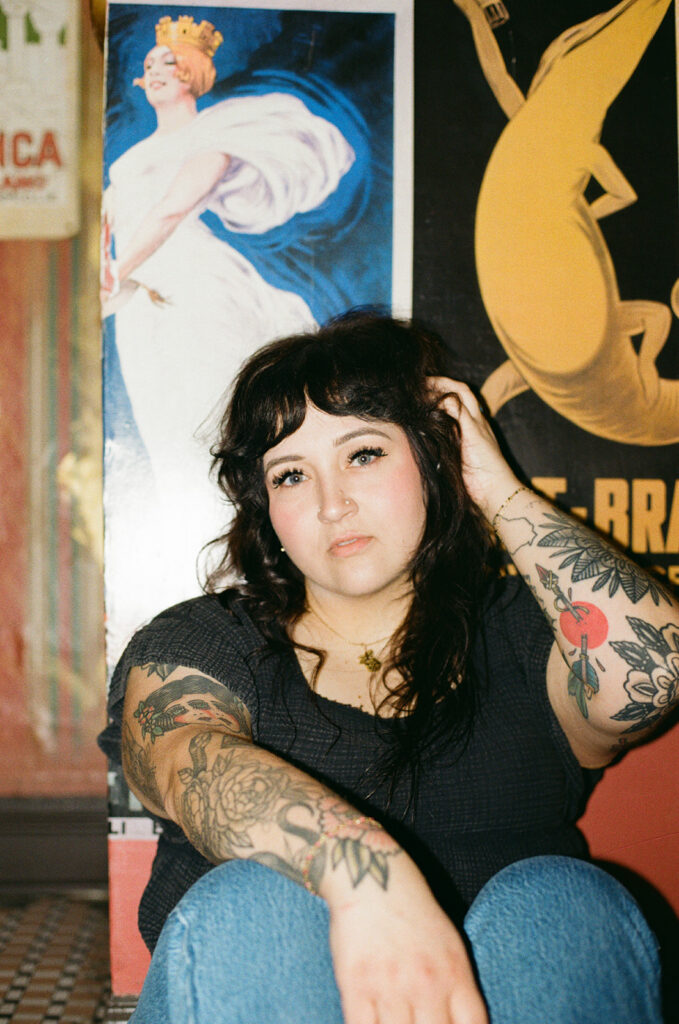 Lady Luck Salon owner, Allie, poses for brand photos with a Milwaukee headshot photographer. 