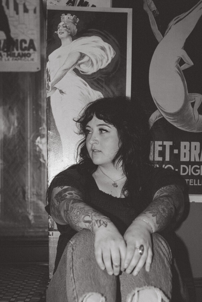 A black and white image of a local  salon owner taken during a milwaukee photography session with a brand photographer. 