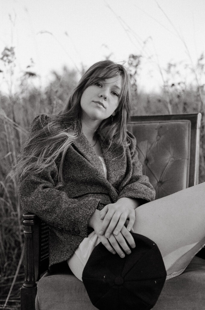 A b+w portrait of a high school senior taken by a Minnesota senior photographer during a vintage inspired photoshoot 