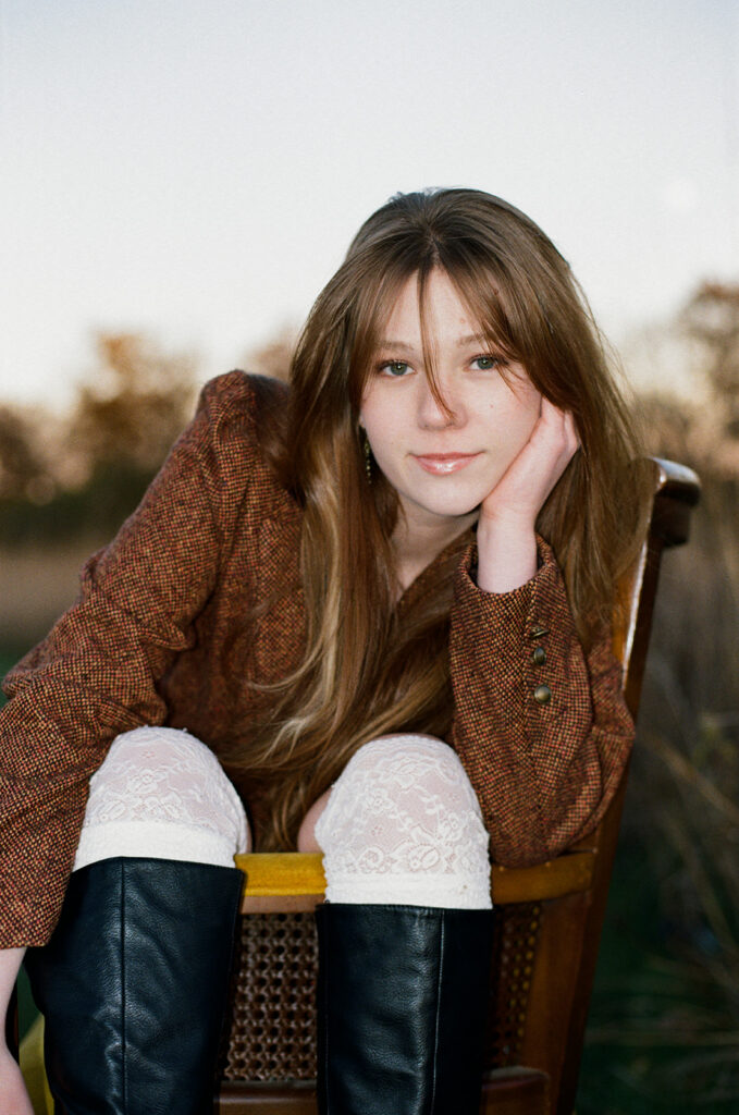 A film portrait of a high school senior taken by a Minnesota senior photographer during a vintage-inspired photoshoot 