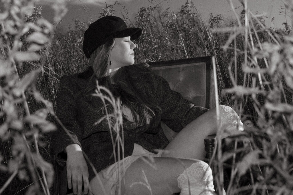 A black and white image depicts a high school senior during a photoshoot at Afton State Park with a Minnesota Senior Photographer. 